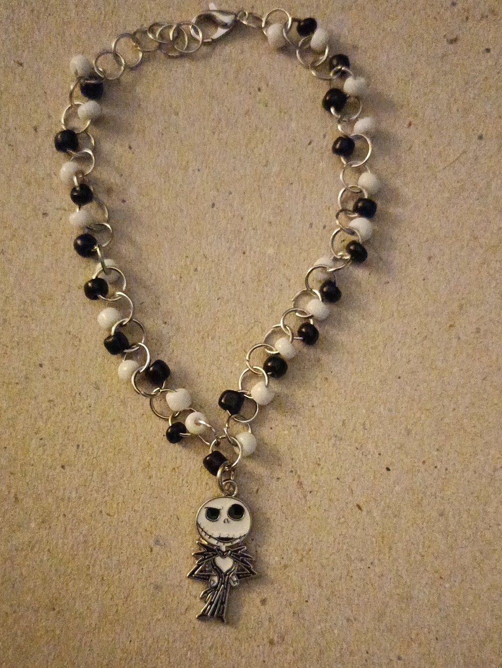 Black & White Beaded Bracelet with Silver Skeleton Charm